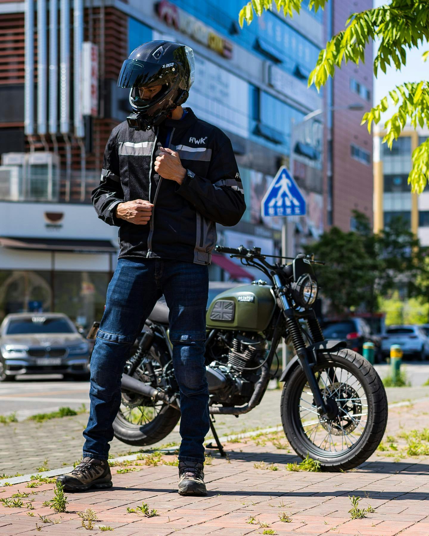 Rider of the Month: Eric standing in front of his parked Brixton Felsberg 125 in Cargo Green