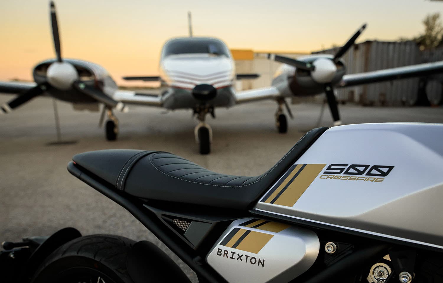 Close-up of the seat of a Brixton Crossfire 500 standing on an airfield in front of a small airplane