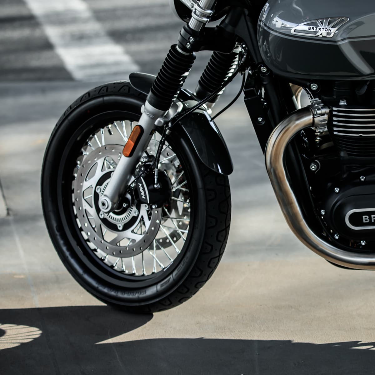 Close-up of the front tyre, brakes and suspension of a Brixton Cromwell 1200 in Timberwolf Grey