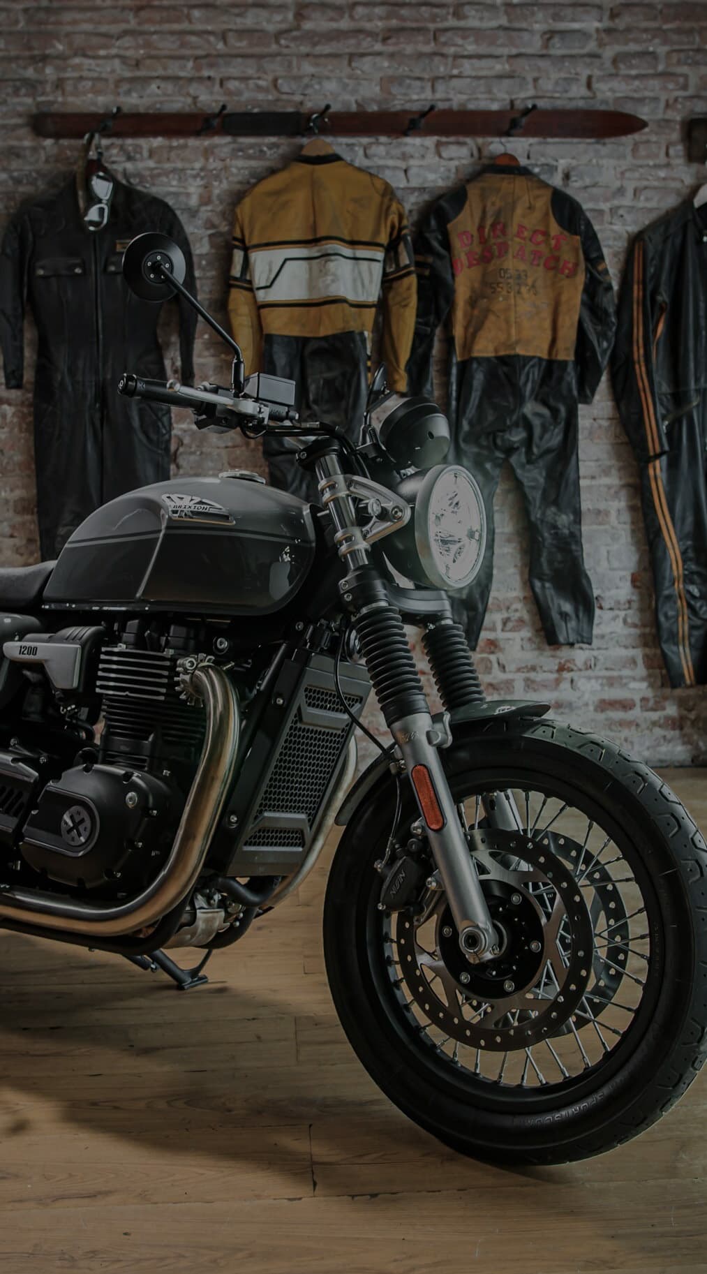 Portrait Marketing Key Visual of the Brixton Cromwell 1200 parked in a Brixton shop/garage