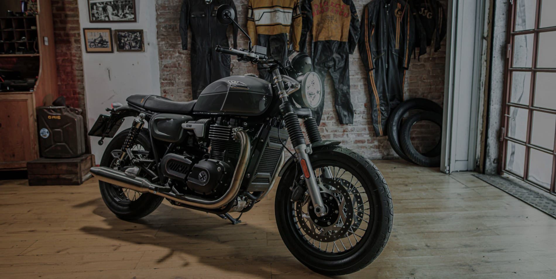 Landscape Marketing Key Visual of the Brixton Cromwell 1200 parked in a Brixton shop/garage