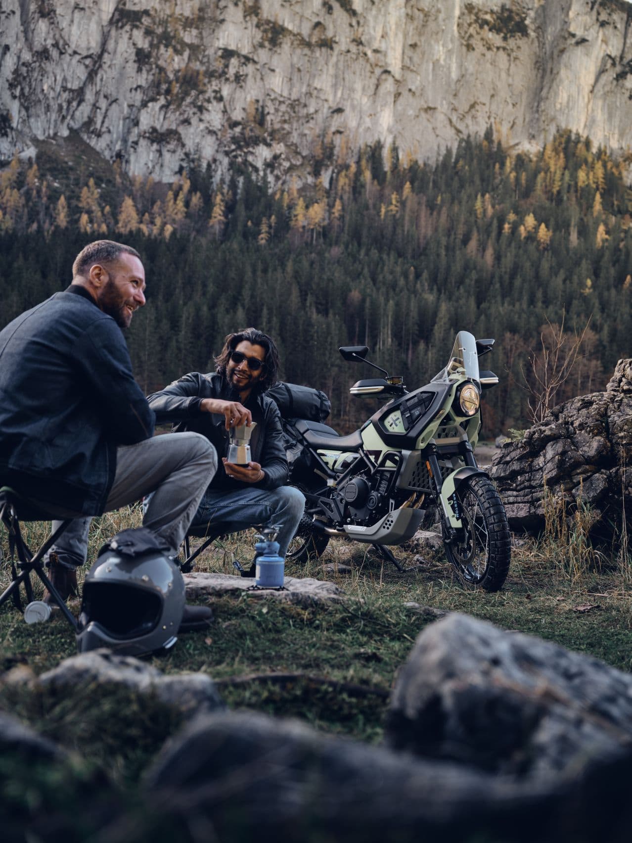 Two men making coffee in the mountains with the new Brixton Storr parked in the background