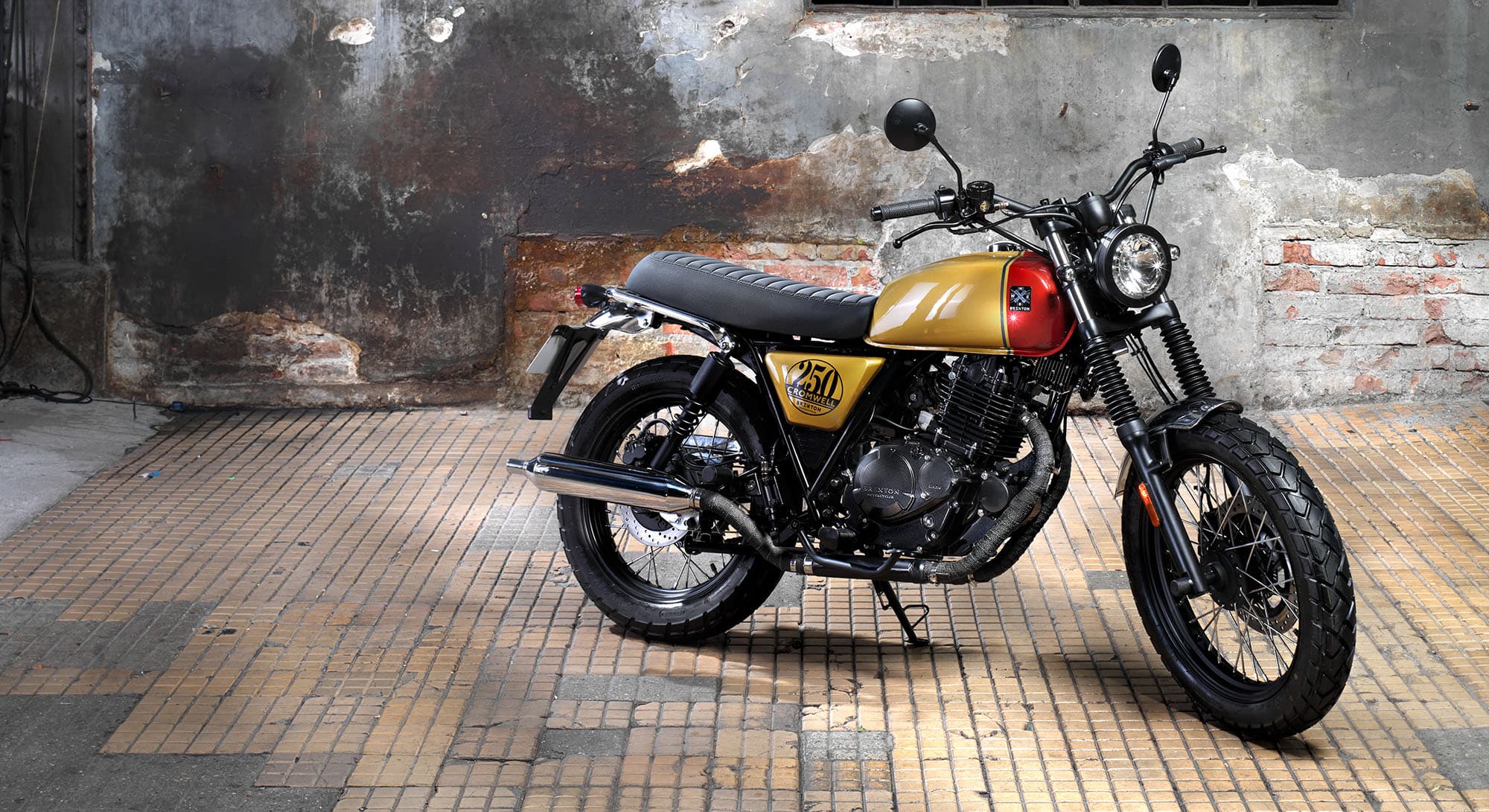 Brixton Cromwell 250 in Desert Gold / Clockwork Orange in a derelict warehouse