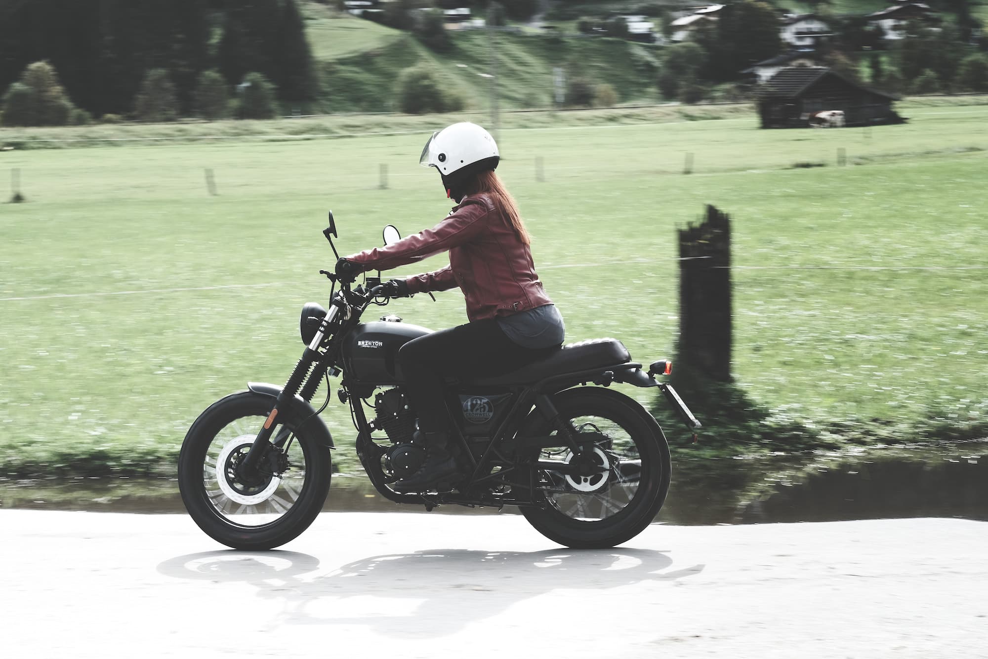Rider of the Month Claudia riding on her Brixton Cromwell 125 in Backstage Black through the countryside