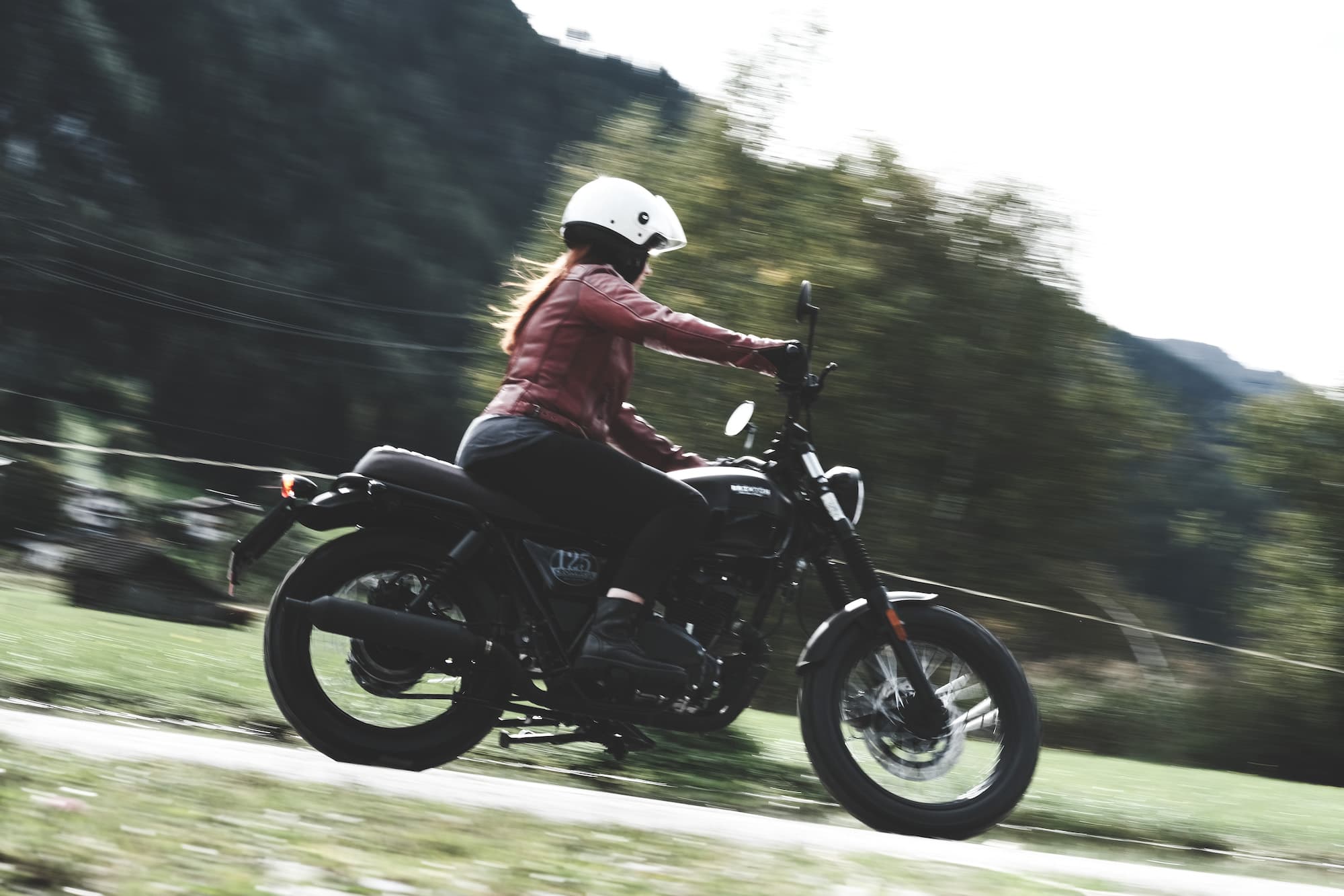Rider of the Month Claudia riding on her Brixton Cromwell 125 in Backstage Black through the countryside