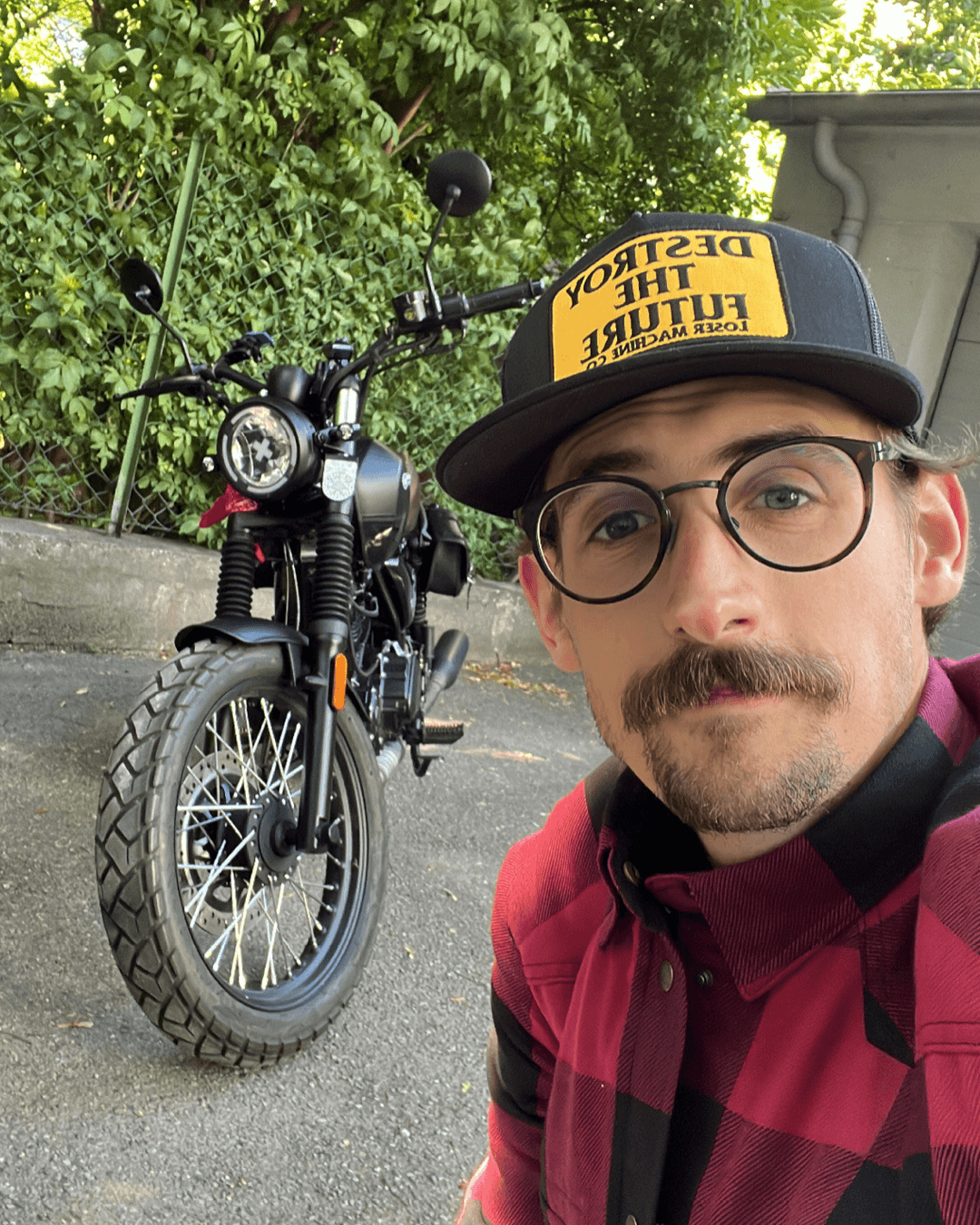 Brixton Motorcycles Rider of the month - Thomas posing in front of his Cromwell 125 in Backstage Black