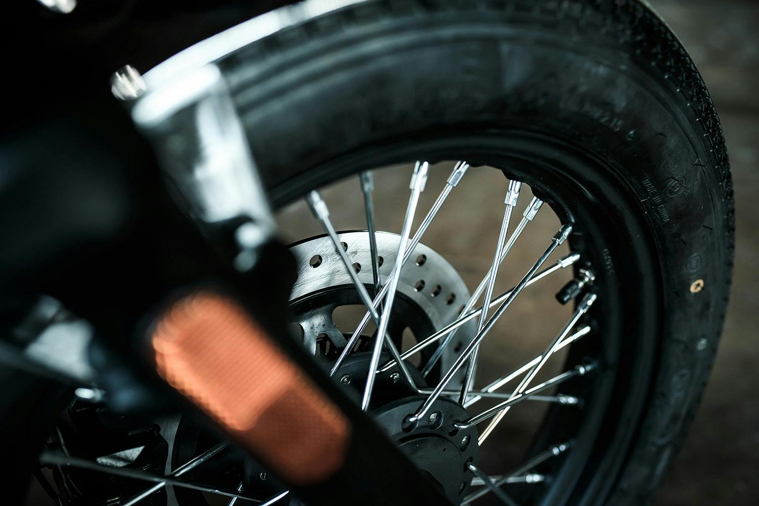 Close-up of the brake system and tyre of a Brixton Sunray 125 in Bullet Silver