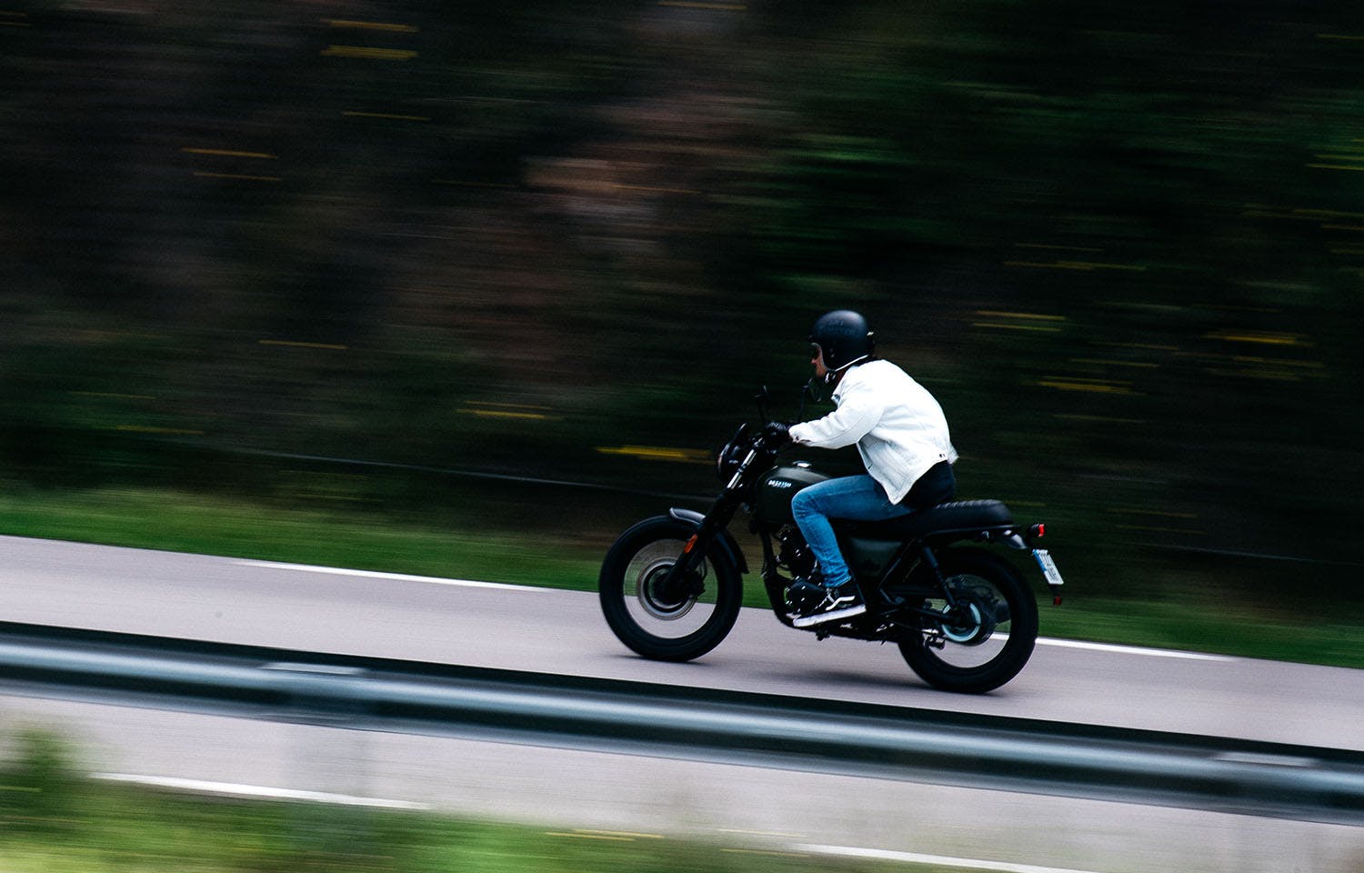 Landscape photo of a Brixton Motorcycles Felsberg 125 being driven on a motorway