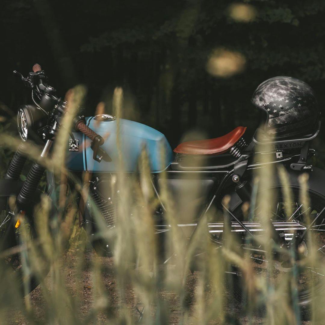 Rider of the Month Kev's Rayburn 125 in Royal Blue Matt / Horizon Blue Matt photographed through blurry blades of grass