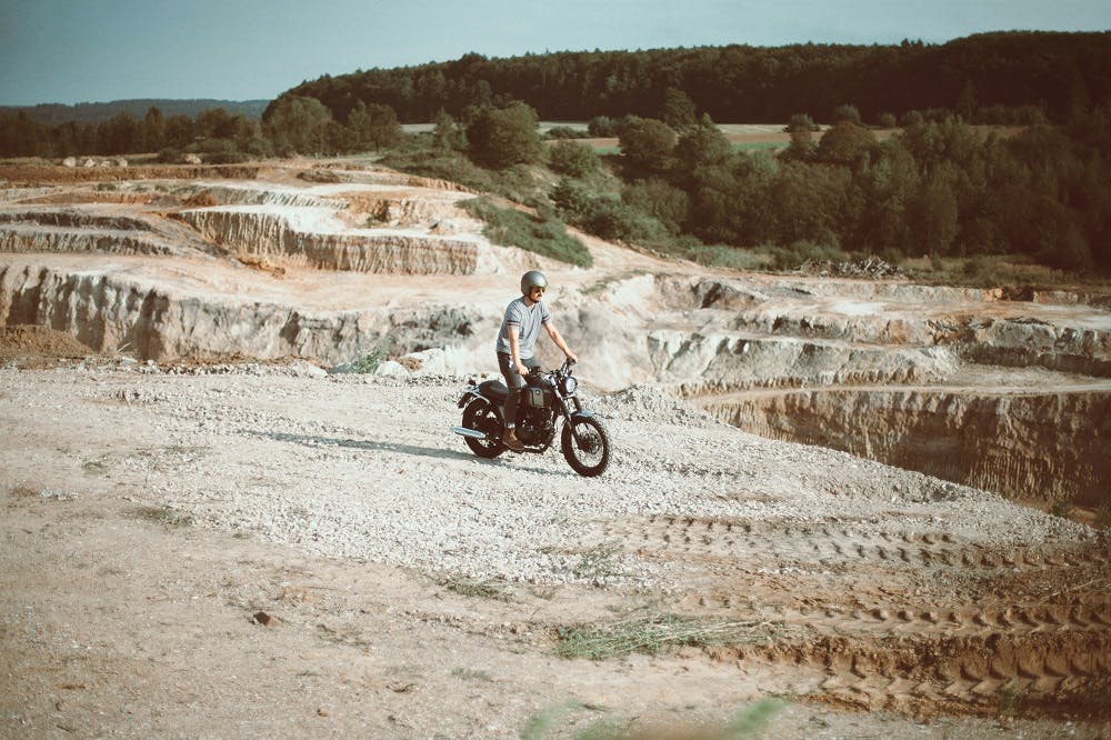 Rider of the Month Sidney riding his Brixton Cromwell 125 in Timberwolf Grey in a quarry