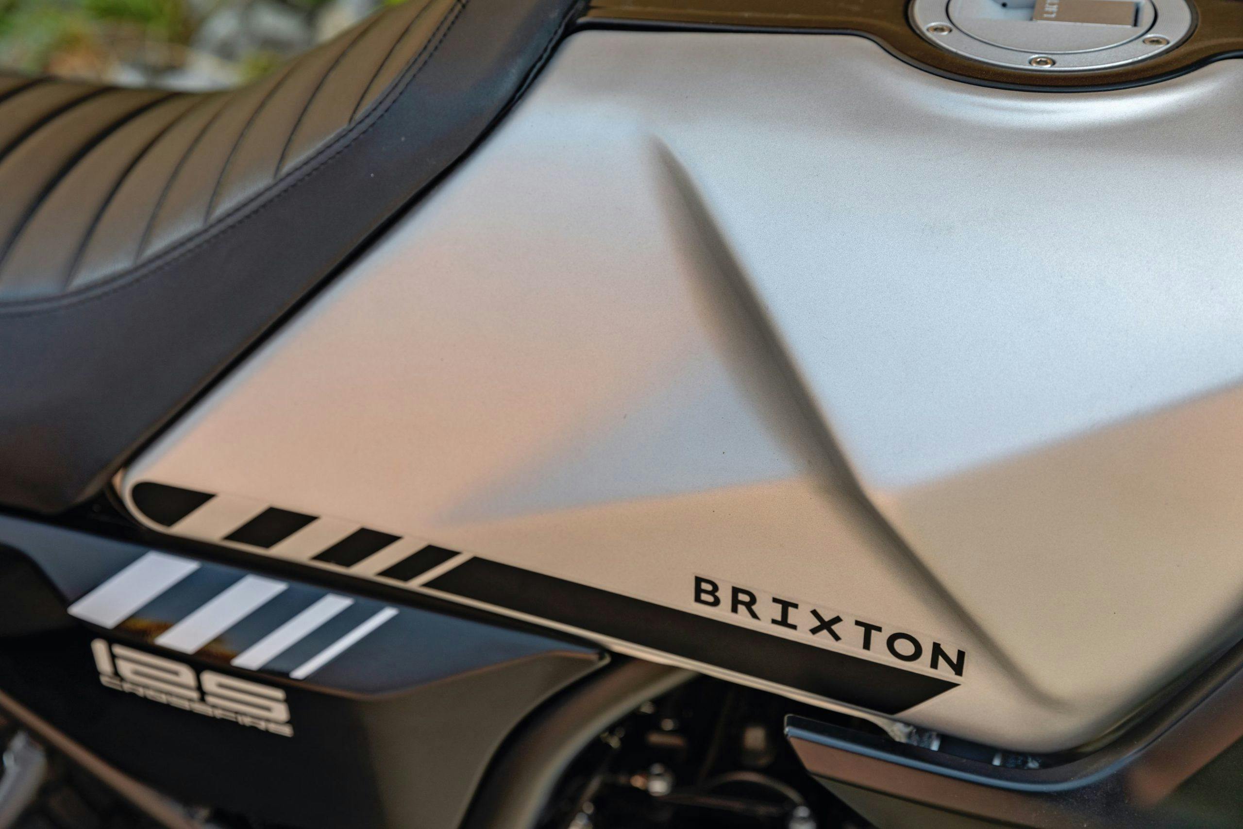 Close-up of the right side of the fuel tank of a Brixton Crossfire 125 in Bullet Silver