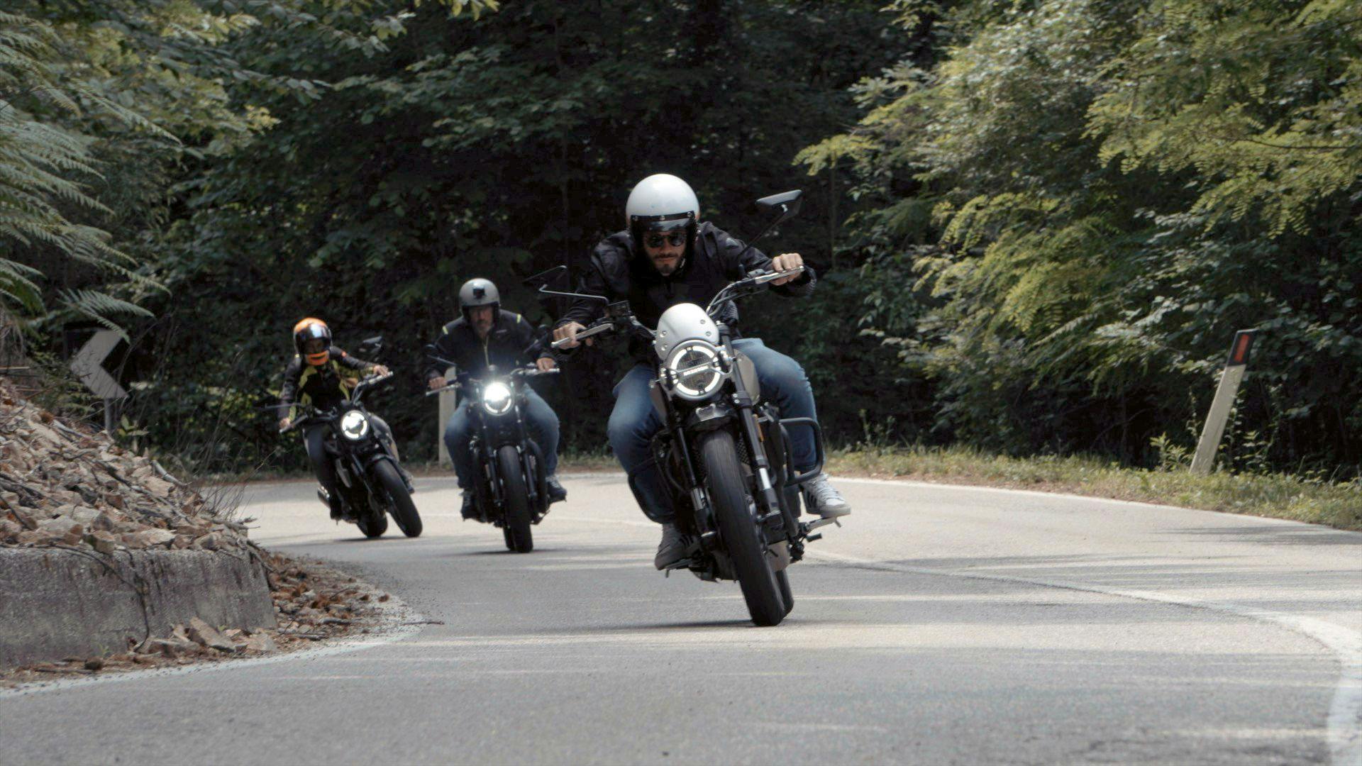 Three Brixton motorcycle riders on their Brixtons riding up a mountain road